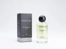 Sinoure Grandeur For Him perfume bottle with clear liquid and black round cap next to black and white packaging box.
