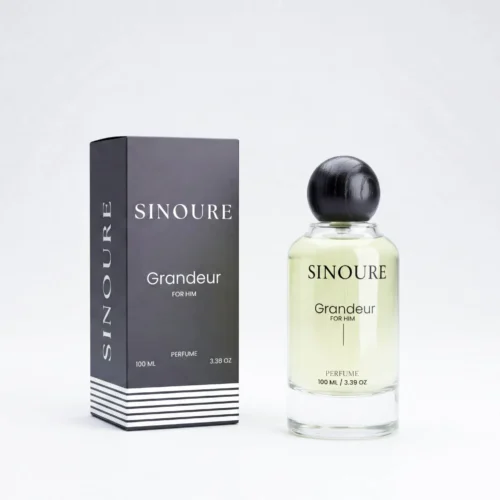 Sinoure Grandeur For Him perfume bottle with clear liquid and black round cap next to black and white packaging box.
