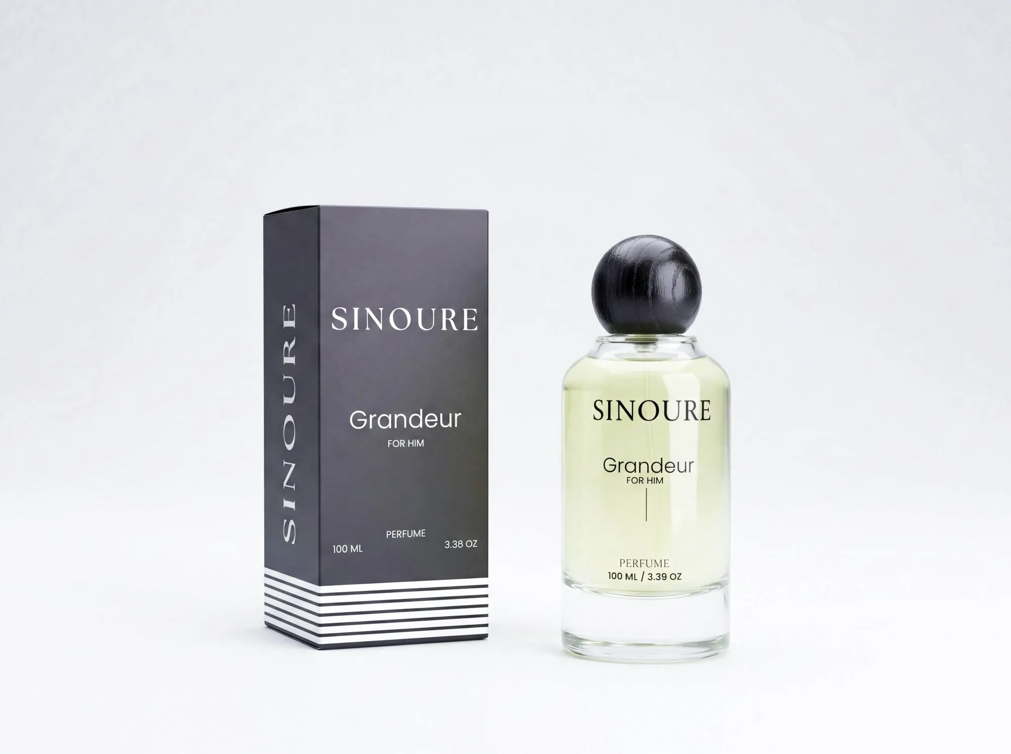 Sinoure Grandeur For Him perfume bottle with clear liquid and black round cap next to black and white packaging box.
