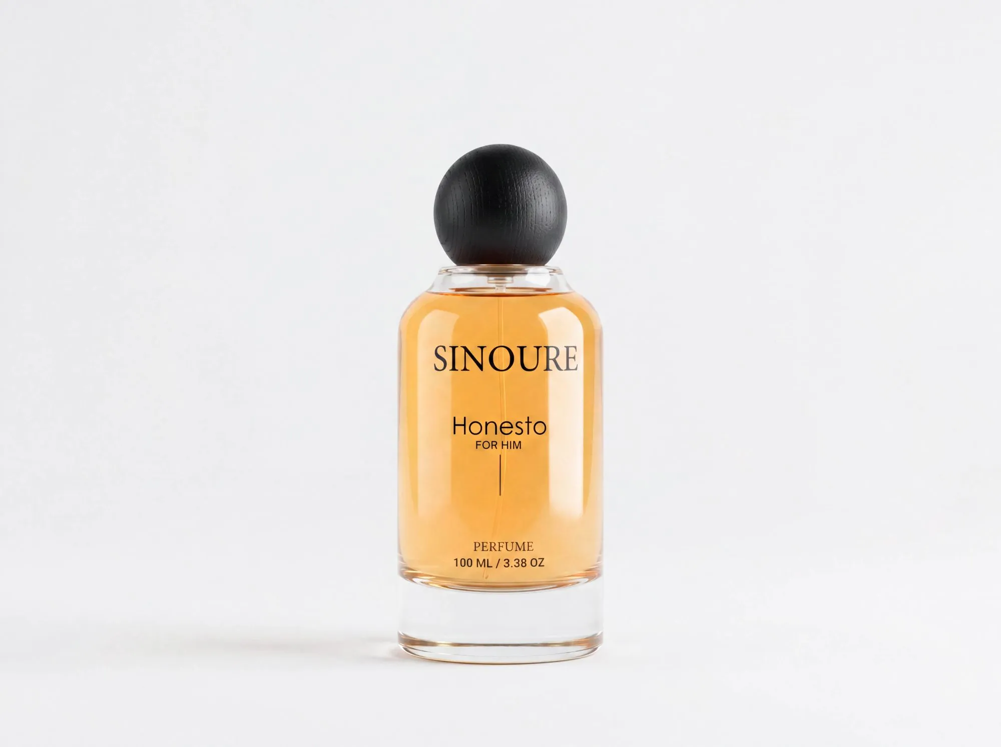 SINOURE Honesto For Him amber perfume in clear bottle on a white background